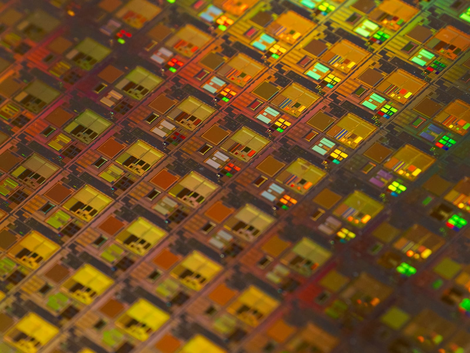 Macro of a silicon wafer showing an indexed grid of dies